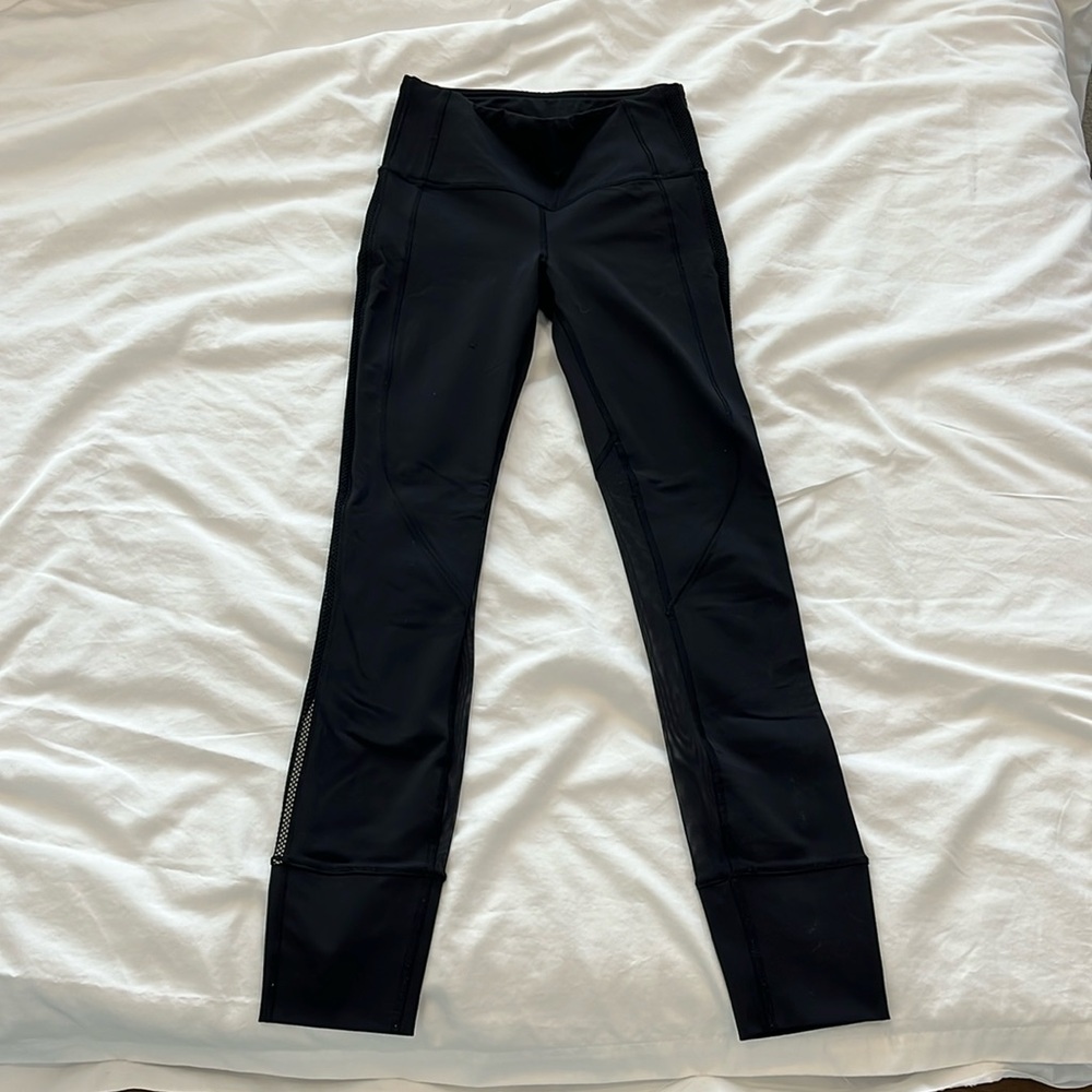 Lululemon leggings, black, mesh back of legs, and drawstring in Size 2.